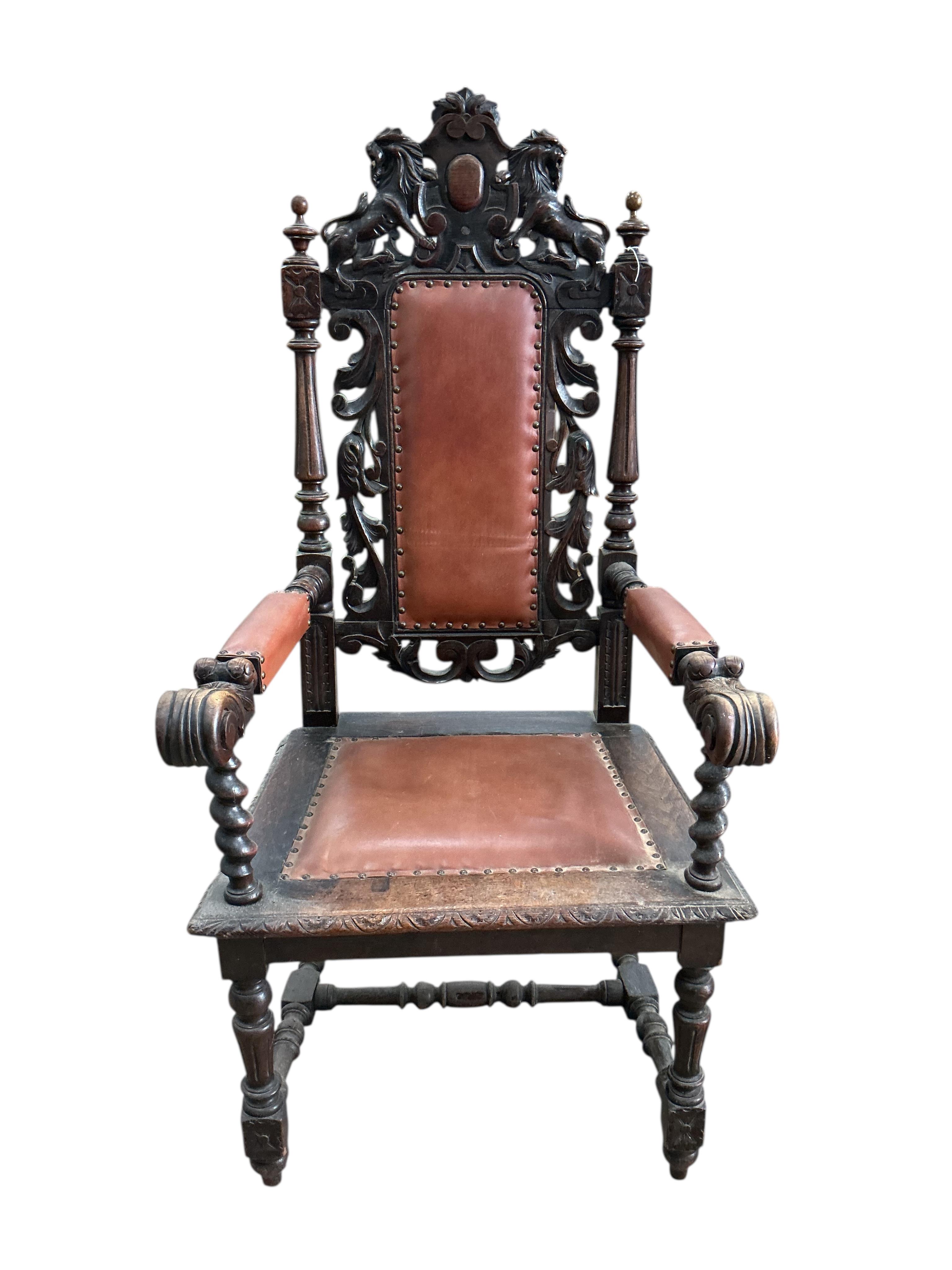 A late Victorian carved oak elbow chair, width 64cm, depth 62cm, height 136cm